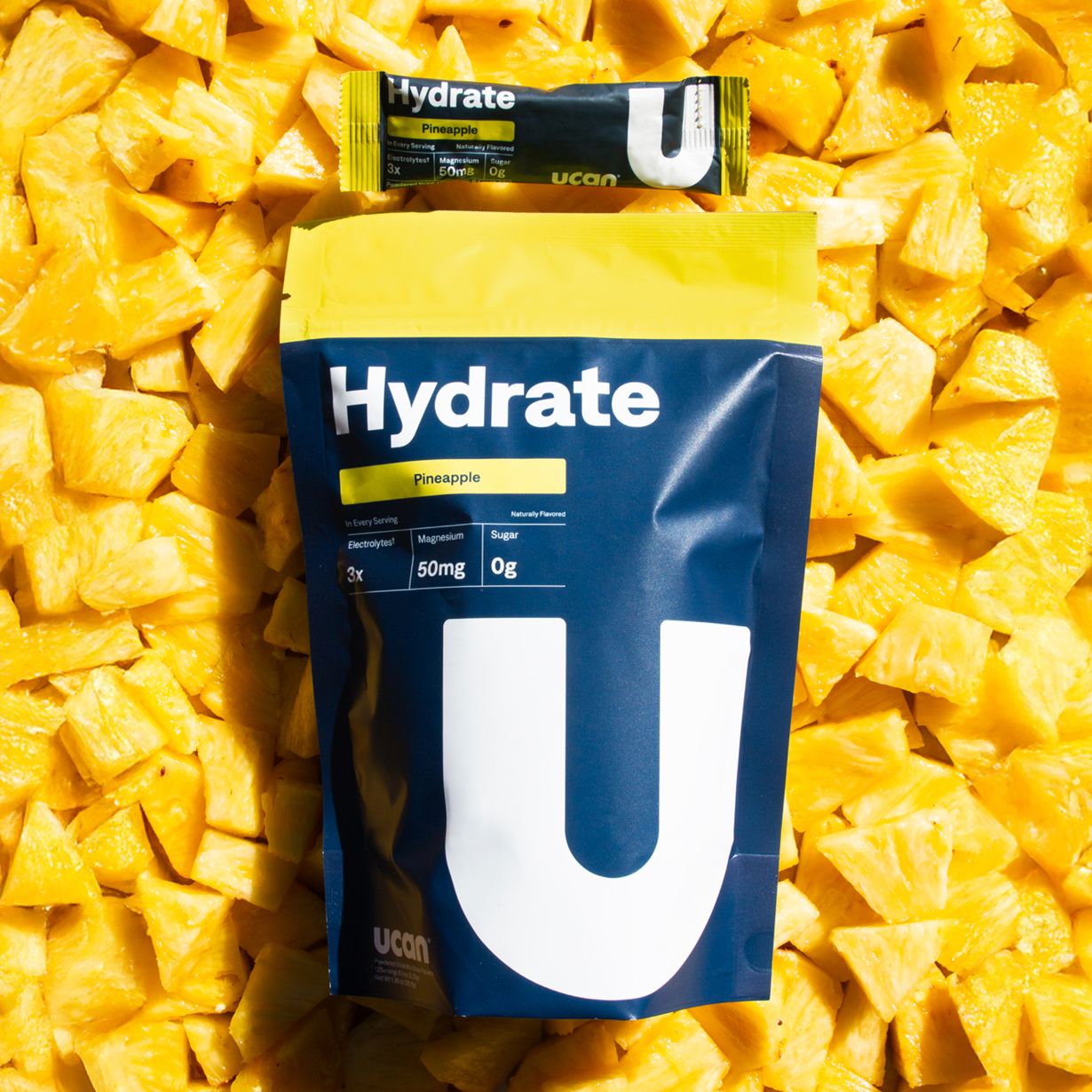 Pineapple Hydrate Electrolyte Packets - UCAN - The Track and Field Store